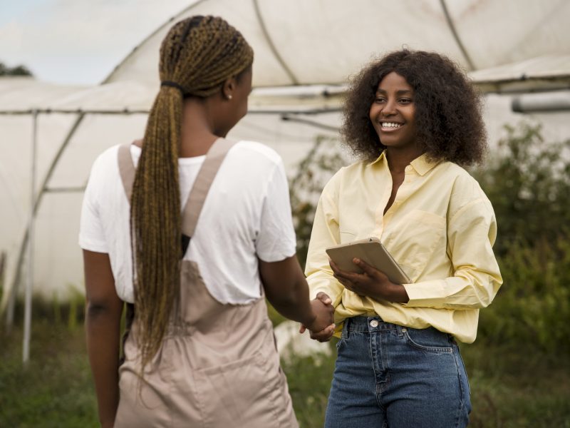 Business women shaking hands